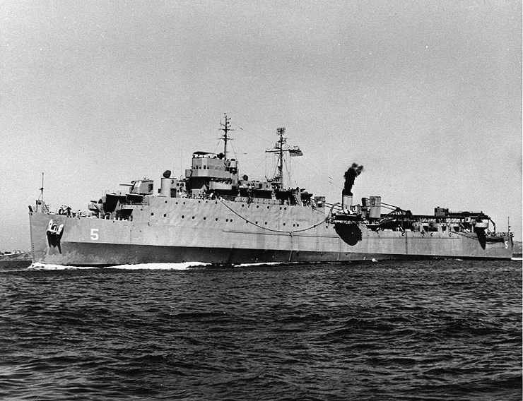 Sorry, this image doesn’t match Gunston Hall—it shows a large military ship moving across choppy water, with a tall superstructure, smokestack, and the number 5 painted on the hull.